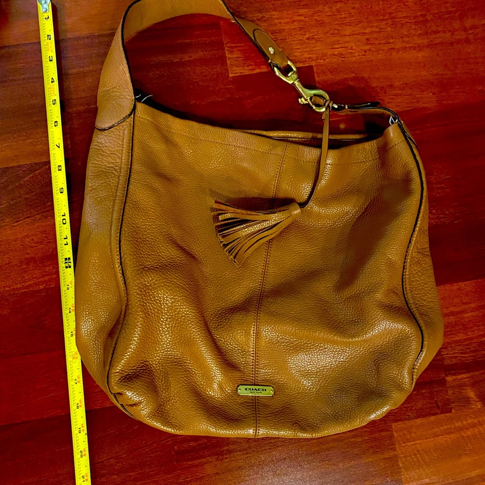 Coach shoulder bag , good condition. Pen marks on the interior. Soft leather